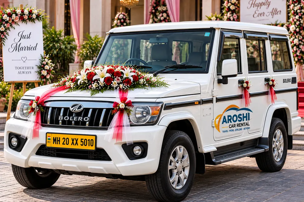 White Mahindra Bolero decorated with flowers for a wedding